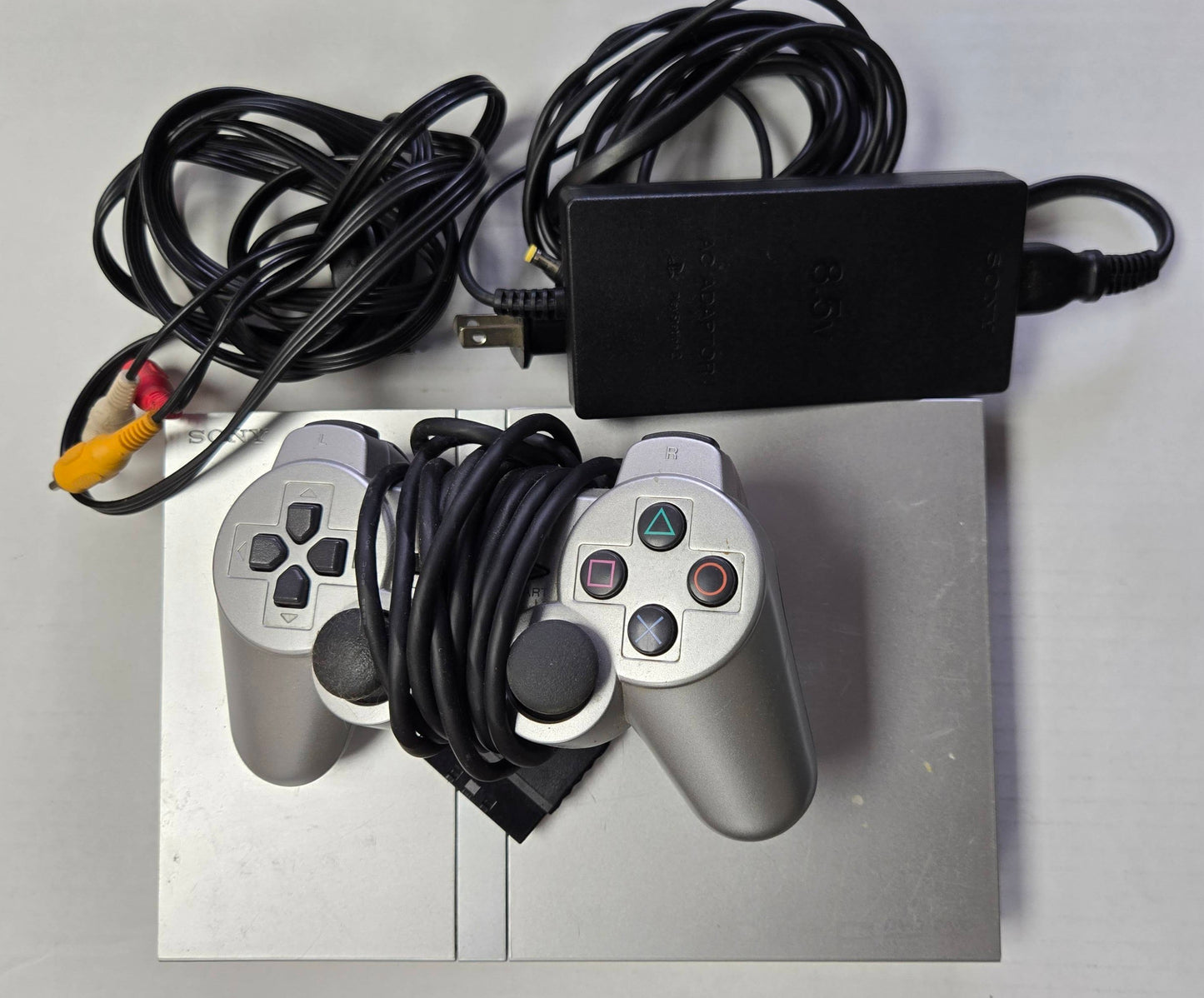 Auction Item 59: Silver PS2 Slim with 1 Controller